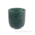 green patterned glass candle holder